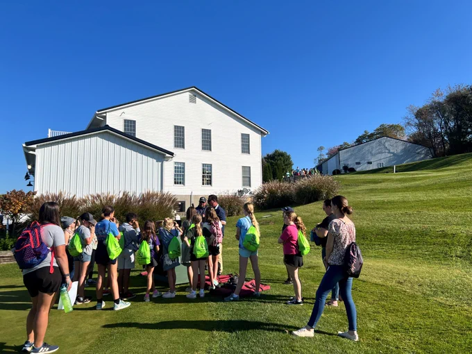 Photo of kids on a golf course.