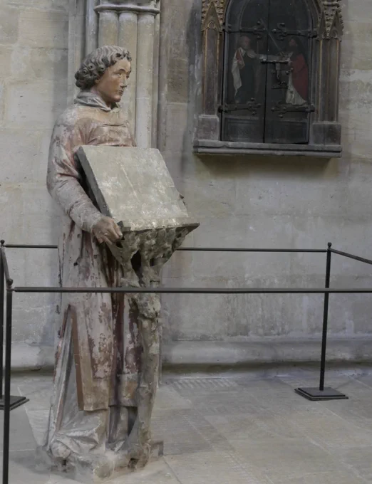 A stone person lectern.