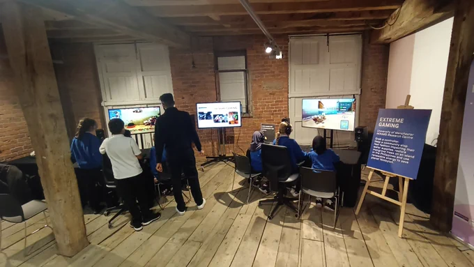Students gather round three different computer screens to play three different video games as apart of the activities for Manchester Science Festival. Activities end on Sunday 27 October