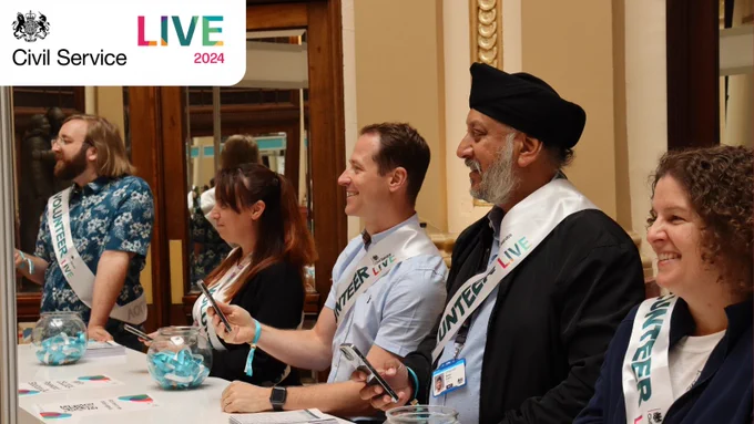 Volunteer civil servants welcoming attendees at Civil Service Live. 