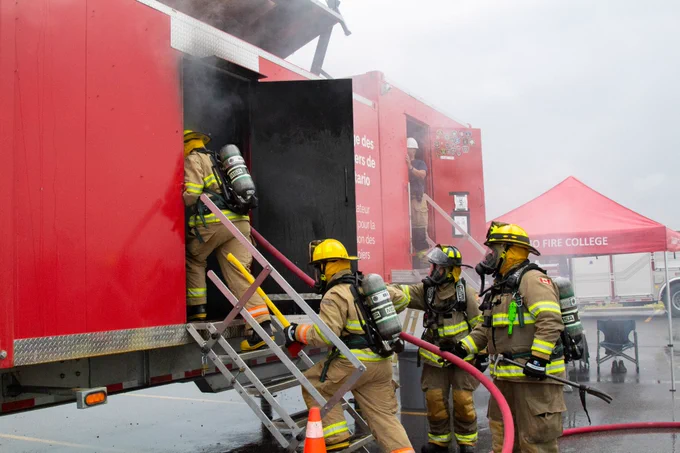 Firefighters going in a real fire for training. 