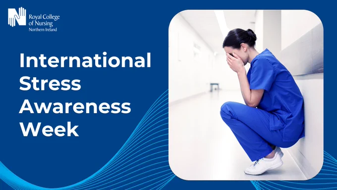 Graphic with royal blue background and wavy light blue lines at bottom. White RCN NI logo top left corner. White text centred left: 'International Stress Awareness Week'. Photo to right: nurse in blue scrubs crouched down against a corridor wall with head in hands.