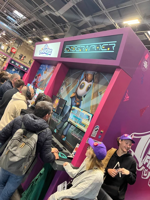Photo of visitors and Jeux Made in France staff trying Exographer at the Jeux Made in France corner at Paris Games Week 2024.