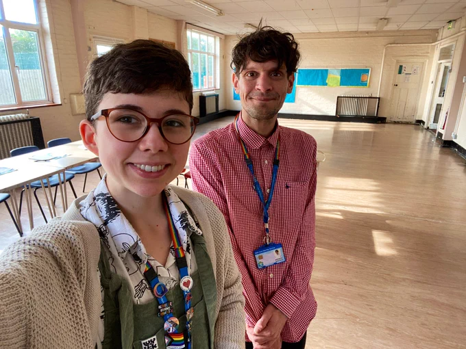 A selfie of James and Leah at a community centre, ready to co-deliver our course ‘Knowing Our Worth’