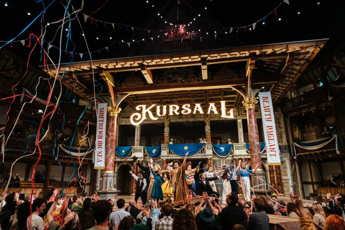 The Company of Princess Essex (2024). 

A group of actors stand together and pose on stage in the Globe Theatre at the end of their performance. Confetti and streamers rain down on the audience in front of the stage.  