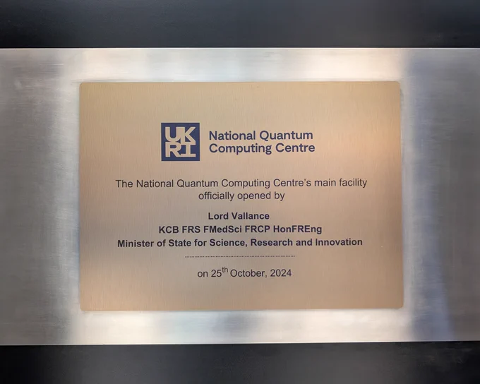 A plaque that says 'The National Quantum Computing Centre's main facility officially opened by Lord Vallance KCB FRS FMedSci FRCP HonFREng Minister of State for Science, Research and Innovation on 25th October, 2024'