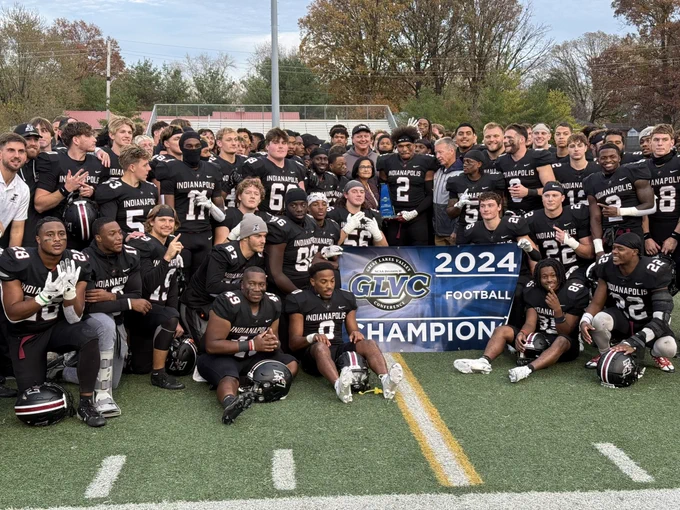 UIndy football Champions with their trophy!