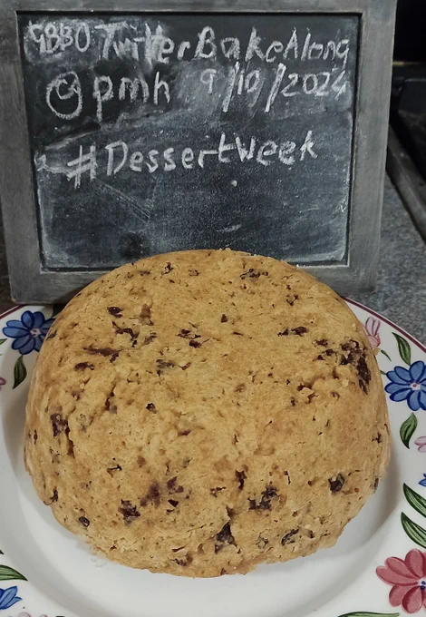 A spotted dick pudding on a plate