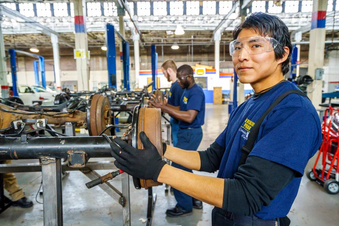 A Native American Job Corps student pictured while working in factory setting.  
