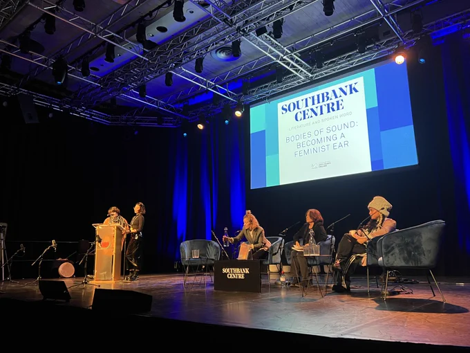 A stage with five women, and a screen that says 'Southbank Centre - Bodies of Sound'