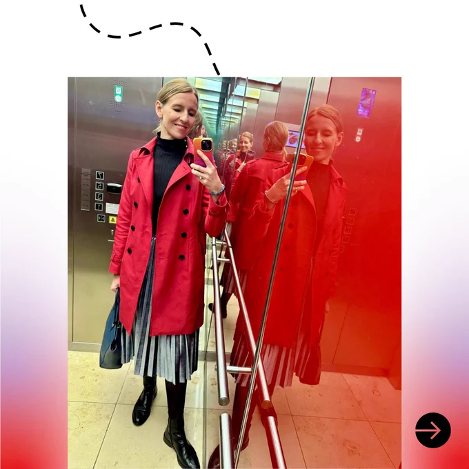 a woman taking a selfie in an elevator
