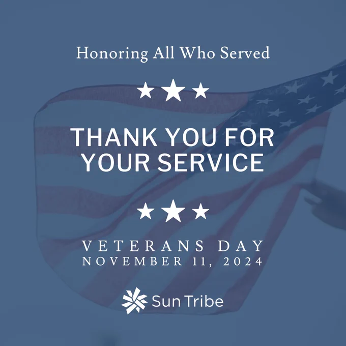 A Veterans Day tribute graphic with a faded image of an American flag in the background. At the top, text reads "Honoring All Who Served" with three stars beneath it. In the center, large text says "THANK YOU FOR YOUR SERVICE," also flanked by stars. At the bottom, it reads "Veterans Day, November 11, 2024" with the Sun Tribe logo beneath.
