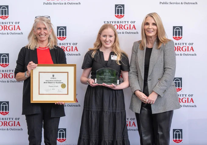 Laurel Clark of the State Botanical Garden of Georgia displays her PSO Staff Award for Excellence with Jennifer Frum, vice president for Public Service and Outreach, and Jenny Cruse-Sanders, director of the State Botanical Garden.
