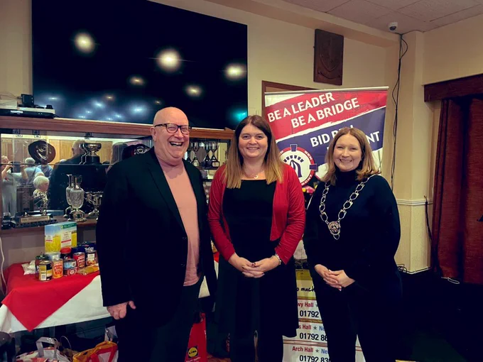 Sioned Williams MS with Mayor Gwenno Ffrancon and Chair of Pantry Foodbank Trustees Steve Hayes standing smiling in Pontardawe Golf Club