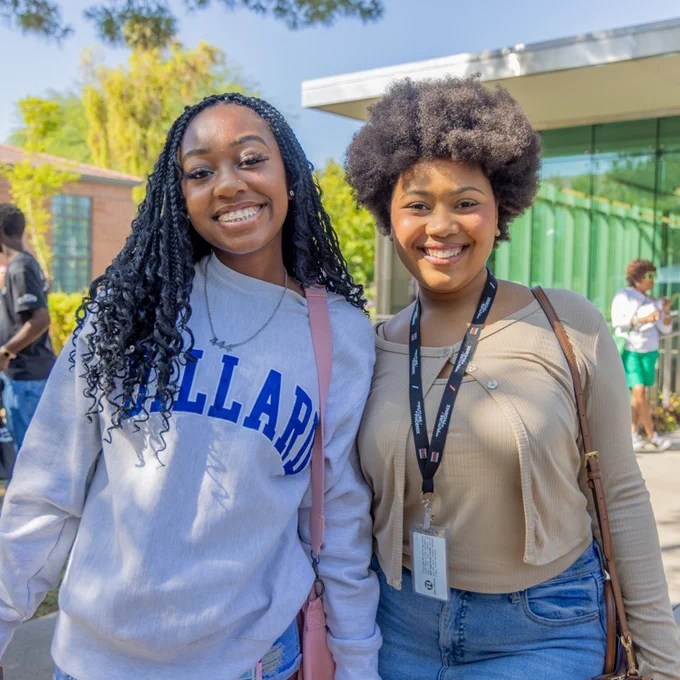 Two girls smiling