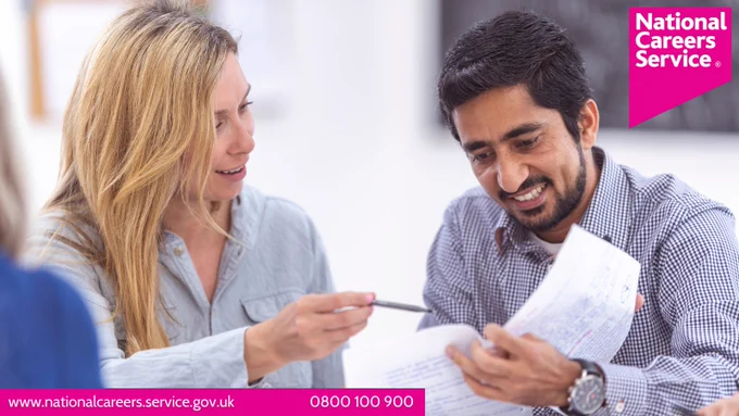 A man looking through some paper with a woman next to him. Top right is the National Careers Service logo.