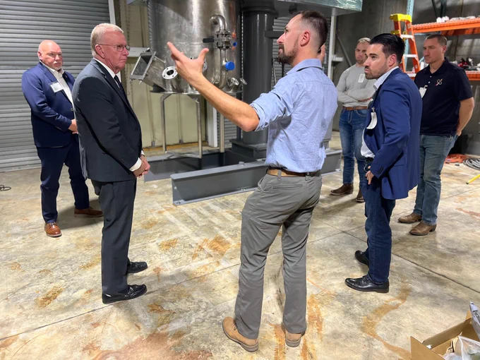 Photo of the Evolution Space team in discussions with Congressman Mike Ezell as he tours the company's NASA Stennis Space Center medium-rate propulsion facilty.