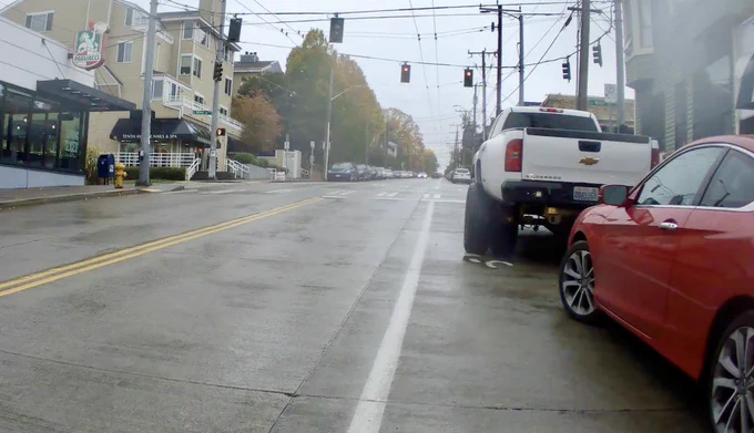 Oversized truck blowing 90% of the door zone bike lane
