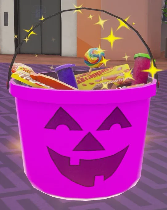A neon purple bucket that's been painted with a jack-o-lantern face. It's filled to the brim with candy.