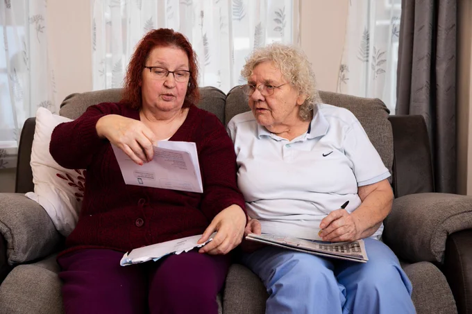 Older women looking at letter