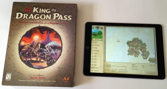 King of DragonPass box next to King of Dragon Pass running on iPad
