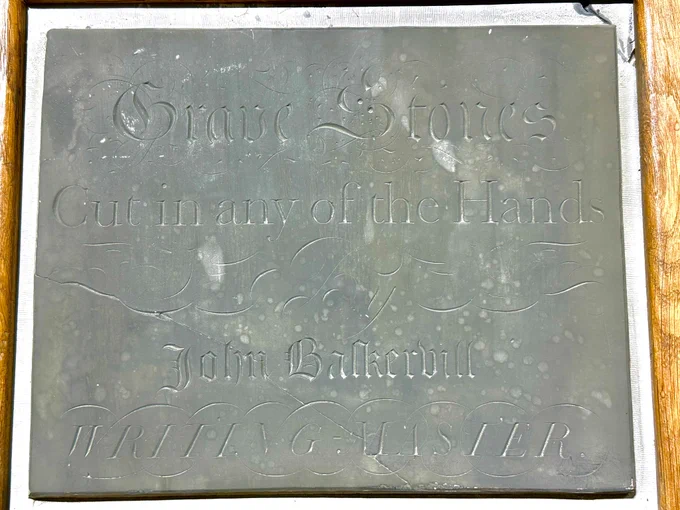 John Baskerville facsimile advert in slate