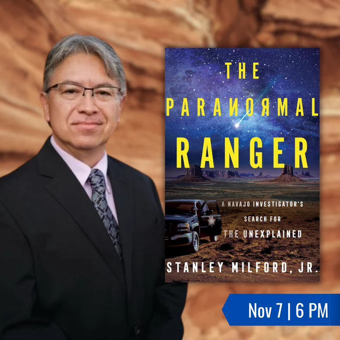 Stanley Milford Junior with a large image of his book The Paranormal Ranger: a Navajo Investigator's Search for the Unexplained. The book shows a pickup truck under a starry sky with a shooting star