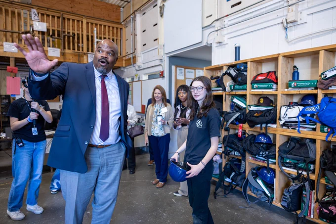 Education Secretary Tutwiler speaks with a student studying plumbing.