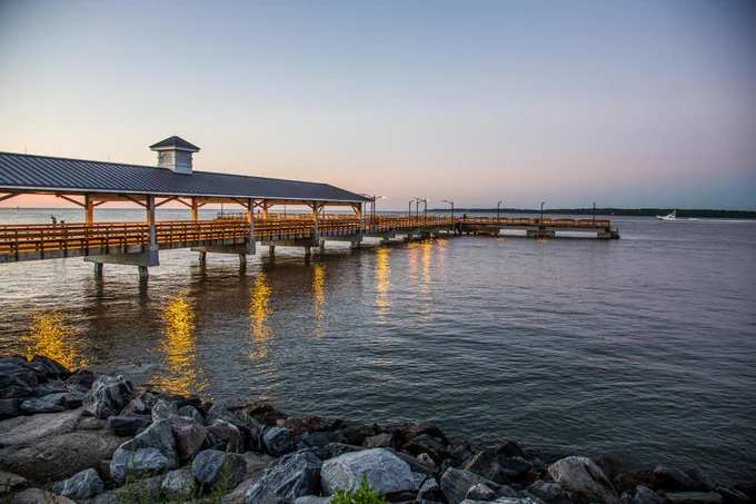 St Simons Island Georgia Golden isles pier on the South end of St Simons in the quaint old town area known as The Village where locals and tourists alike flock for peaceful walks under the oaks and Spanish moss and also take in sites, sounds, and the amazing food by all the many restaurants, cafes and shops. Don't forget the fudge. the seafood. the coffee. or the history of this historic island and the village.