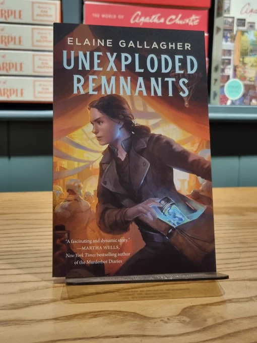A copy of Unexploded Remnants by Elaine Gallagher perched upright on a table. 
