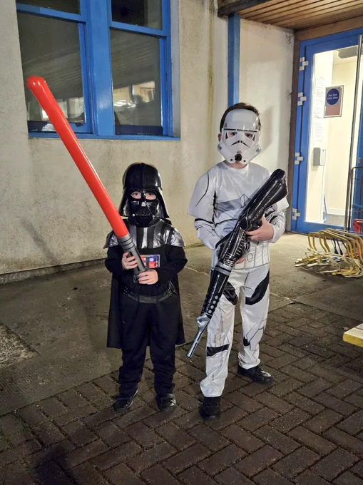 The mini hams dressed for their halloween school disco as darth vader and a storm trooper