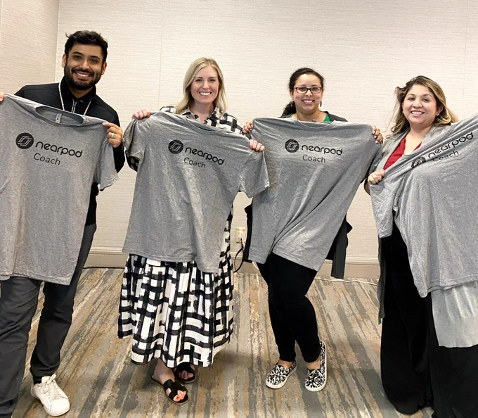Danny, Ashley, LaShaka, and Andrea posing with their Nearpod Coaches shirts.