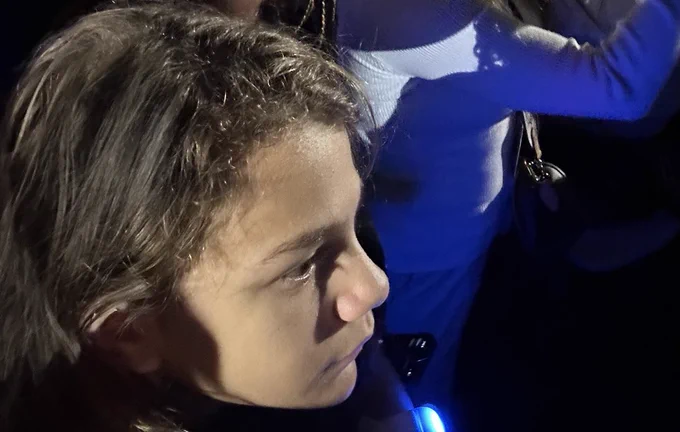 Photo of my daughter listening intently to Vice President Harris.