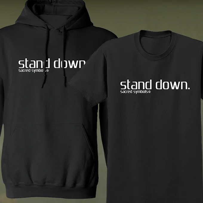 A hoodie and a t-shirt with the words "stand down. sacred symbols" on them