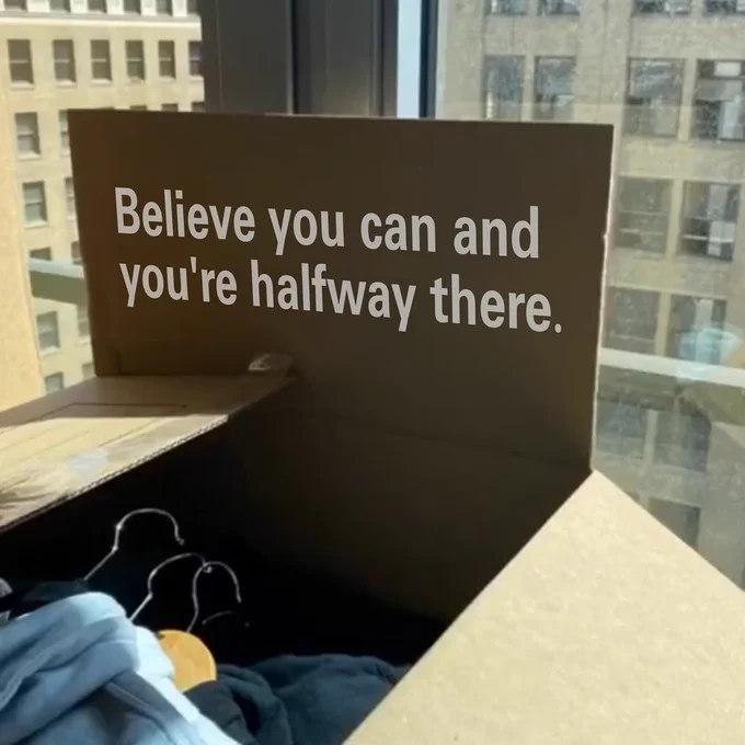 NorthStar Moving box with open flap with the words that say "believe you can and you're halfway there."