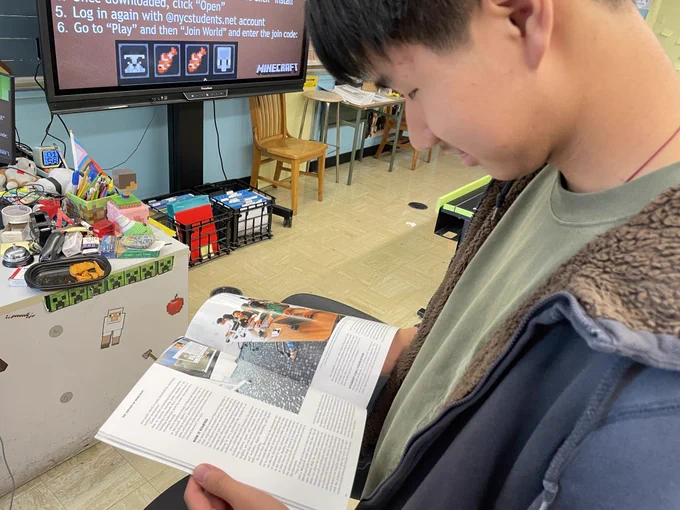 Student reading Time Magazine.