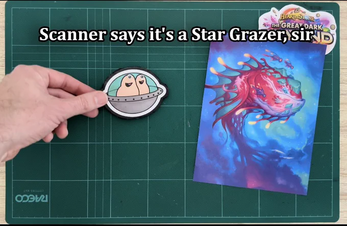 Screenshot from our Great Dark Beyond reveal showing the Chinwagglians coming in from the left to discover the Star Grazer art. On screen subtitle: “Scanner says it’s a Star Grazer, sir”