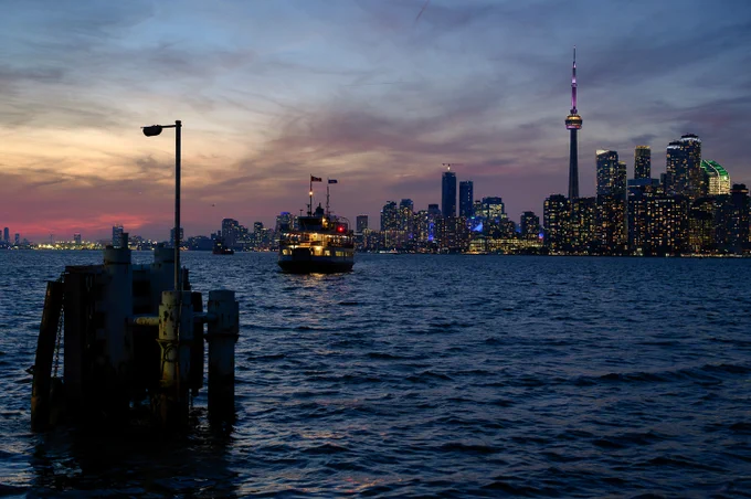 ferry on its way with the toronto skyline in background
