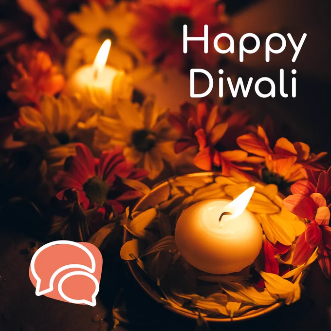 Happy Diwali! There’s a background photo of a lit candles surrounded by flowers. There’s also a line drawing of some speech bubbles. 