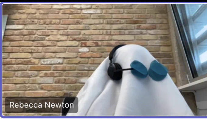 Screenshot of me dressed with a sheet as a ghost wearing a headset during a teams meeting
