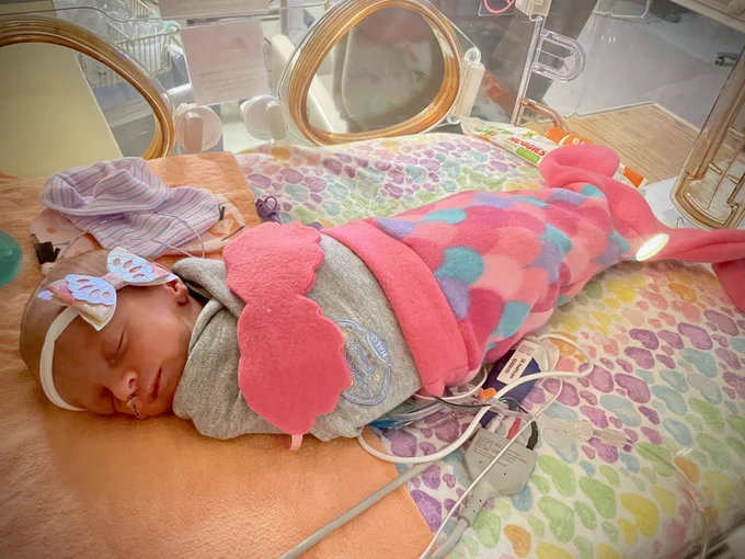 NICU baby dressed as mermaid