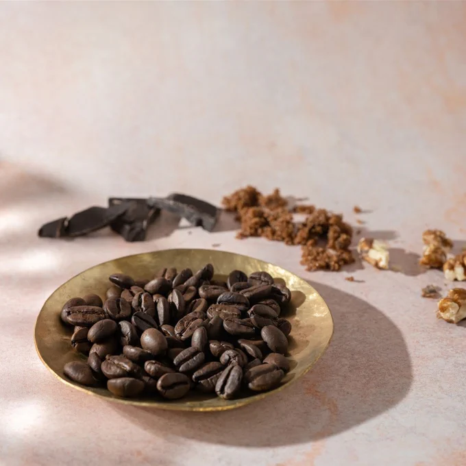 
Discover India Malabar Monsooned Coffee
Grown along the Malabar coast in Kerala, this coffee has a heritage as rich as its flavour. Inspired by the monsoon winds and sea air that once travelled with it, our India Malabar Monsooned is transformed through a unique process to bring you a full-bodied coffee with a mellow, smooth taste and delicate hints of spice. Roasted to accentuate its richness, this coffee offers a smooth cup with notes of burnt sugar, walnut, and bitter chocolate.