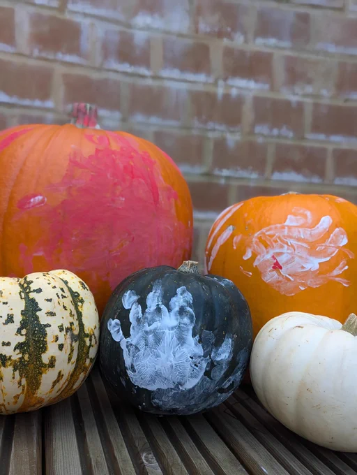Pumpkins decorated for Halloween by Teddy Barrett.