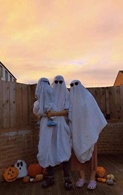 Jordan, Ruth and Teddy Barrett dress as ghosts. They are all wearing sunglasses and Crocs.