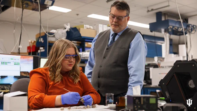 Professor, Department of Chemistry and Chemical Biology John Goodpaster and his graduate student Alexis Hecker work in his lab at the School of Science.
