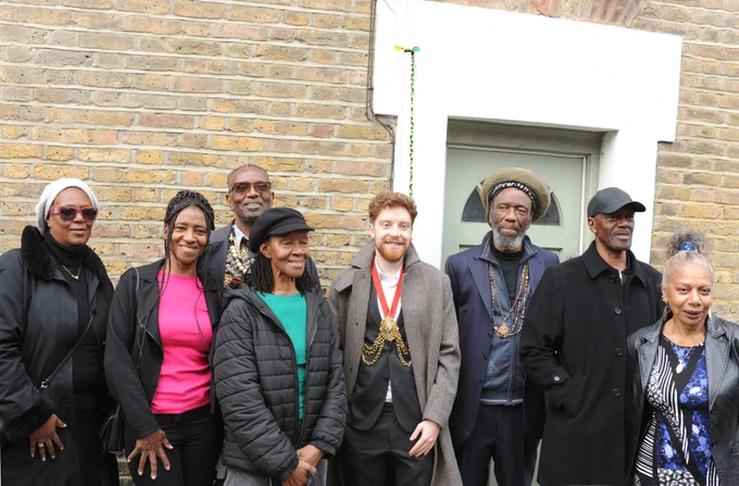 Olive Morris' family with the Mayor of Lambeth outside the house on Railton where Olive Morris lived.