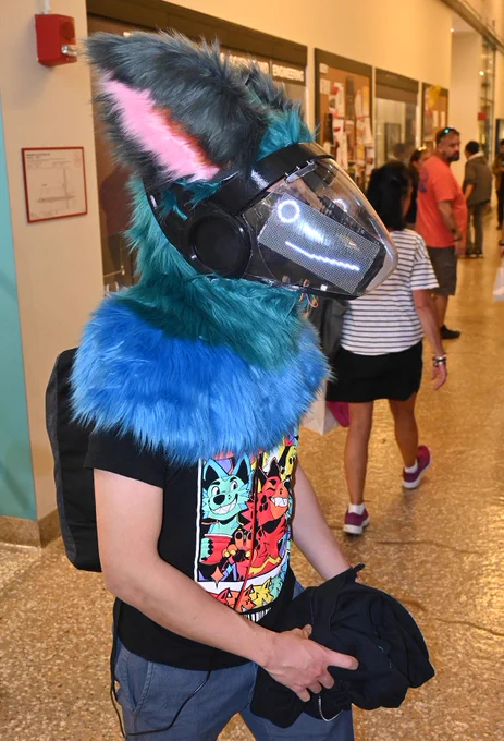 Student wearing a fluffy blue and pink mask.