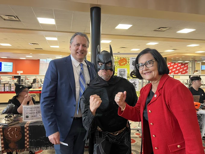 Pres. Singh and Provost Plouff with the real Batman!