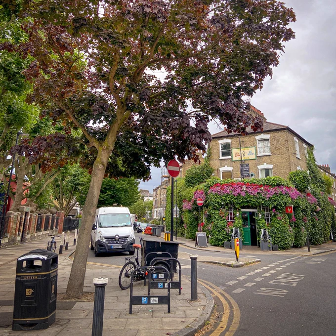 A narrowed road junction shows how the space can be made more pedestrian friendly, and more nature friendly.