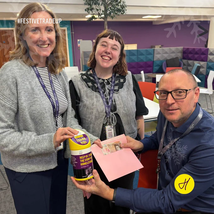 Hopestead Head of Operations Lucy Parish and Bethan Bishop present Flagship Group’s Director (Strategic Asset Management) Garry Knights with £10 for the festive fundraiser.